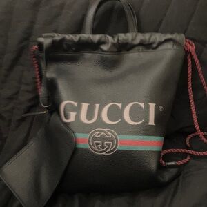 Authentic. Gucci Black and Red Drawstring Backpack super soft leather.
